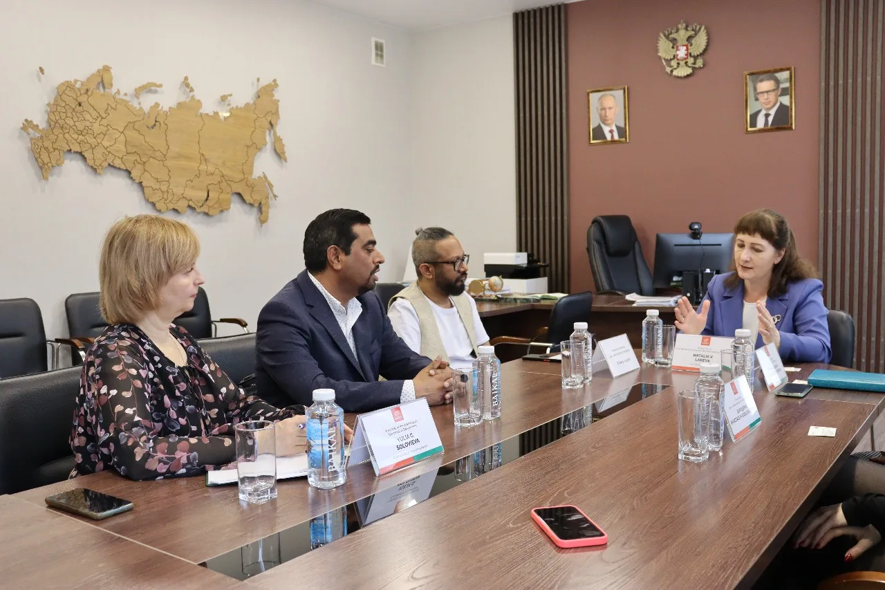 Academy representatives and visiting delegates in an institutional discussion